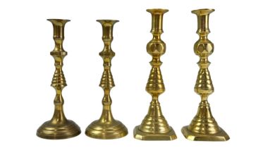 A pair of Victorian brass candlesticks, 28 cm, and one other pair