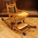A late 19th / early 20th Century childs oak metamorphic rocking and feeding chair