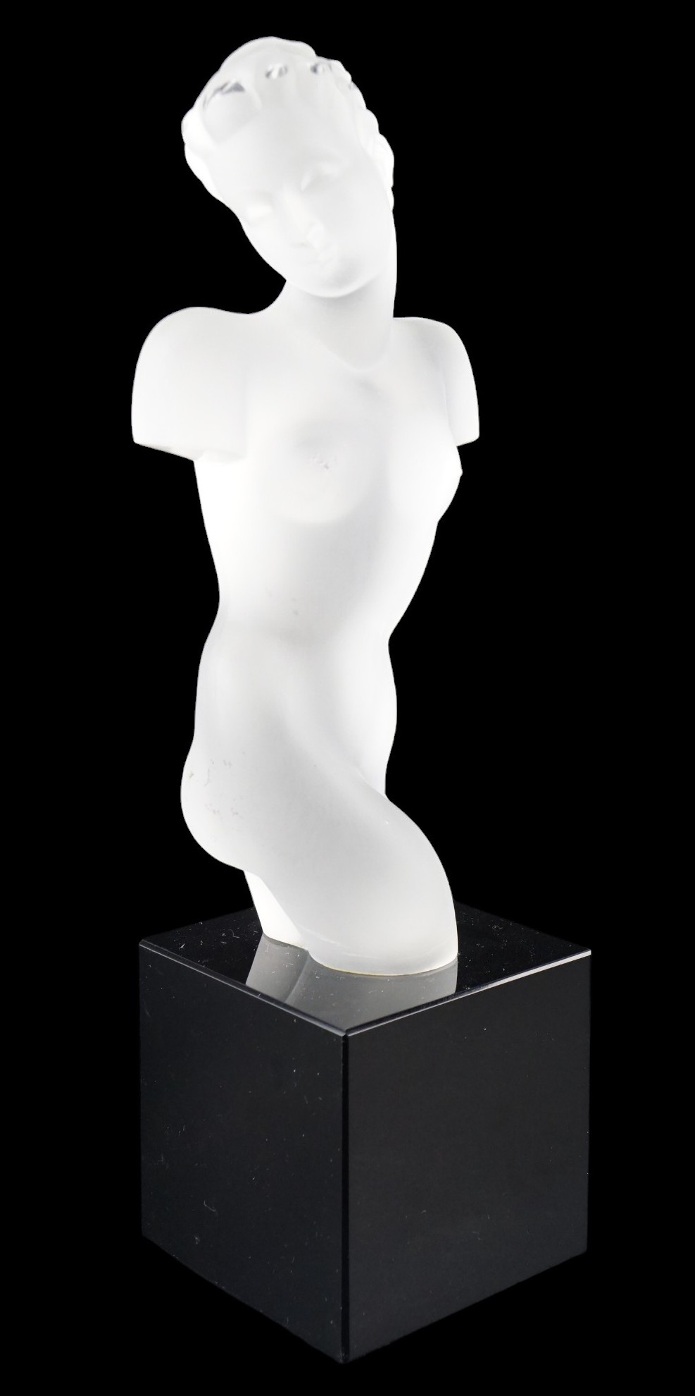 An Art Deco style frosted glass nude sculpture on a black glass plinth, 30 cm