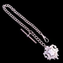 An Edwardian silver curb-link watch chain having a vacant Victorian open-work fob medallion,