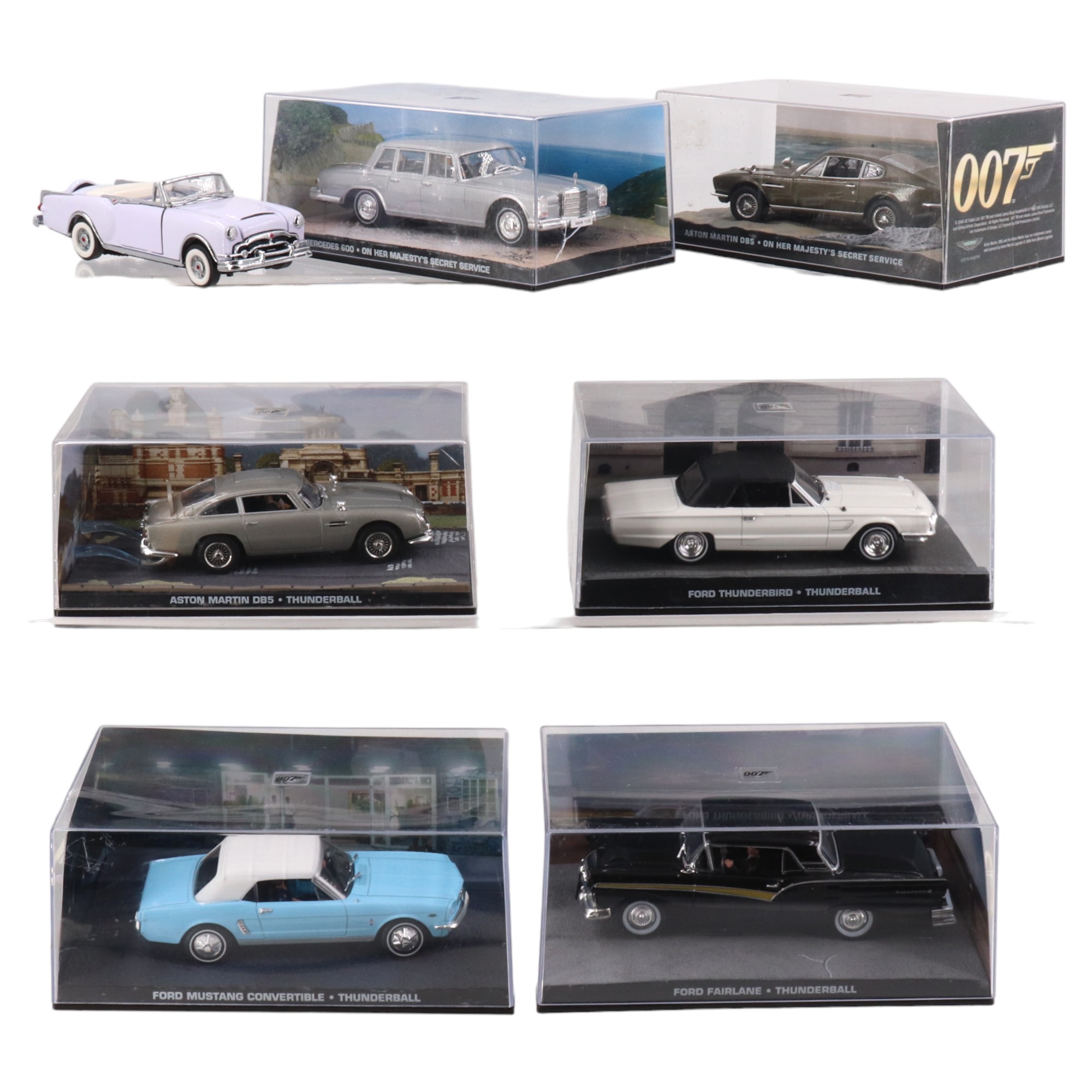 Six James Bond 007 diecast cars in display cases, by GE Fabbri Ltd, together with a Franklin Mint