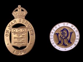 A Great War "Prisoners of War Help" enamelled lapel badge together with a 1915 "On War Service"
