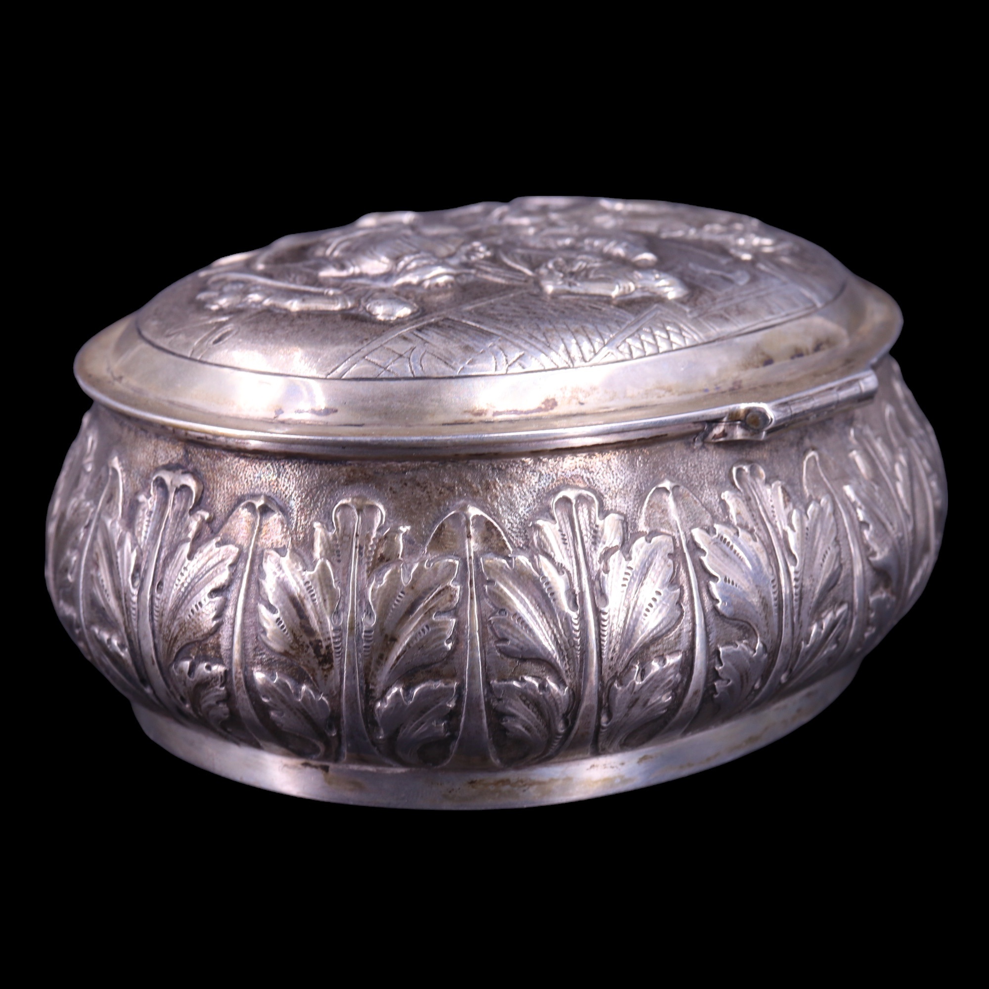 A Dutch white-metal tobacco or similar box, of oval bombe form, the hinged lid relief decorated in - Image 4 of 8