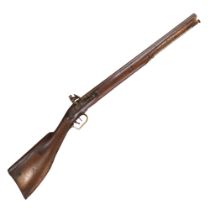 An early 19th Century flintlock rifle, having a 26-inch sighted octagonal barrel with nine-groove