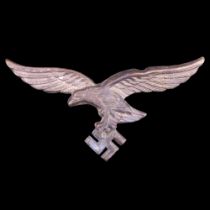 A German Third Reich Luftwaffe peaked cap badge, 68 mm