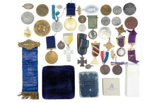 A group of medals, medallions and tokens including a cased John Hardie Medal, St Johns Ambulance,