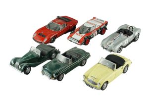 Six Kyosho diecast model cars including a Austin Healey, a Cobra 427, etc, 1:18 scale