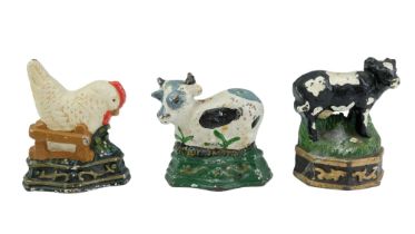 Three painted cast iron novelty door wedges modelled as farm animals, approx 8.5 cm