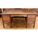 A 1930s-1940s oak office desk, 153 cm x 83 cm x 73 cm high