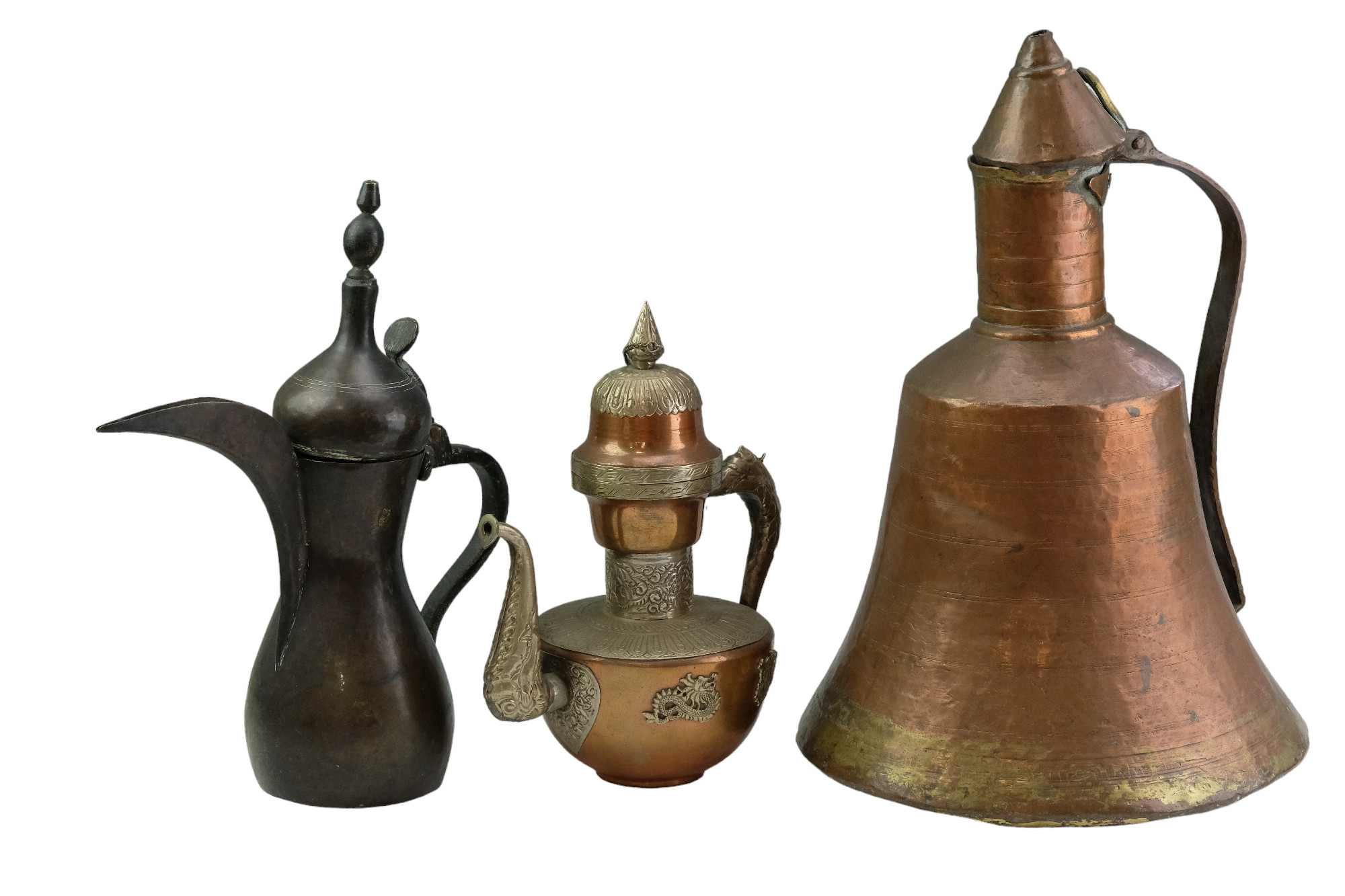A Tibetan copper and nickel alloy tea pot together with an Islamic dallah coffee pot and one other