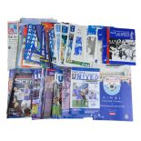 A collection of 1990s and later Carlisle United Football Club matchday programmes together with team