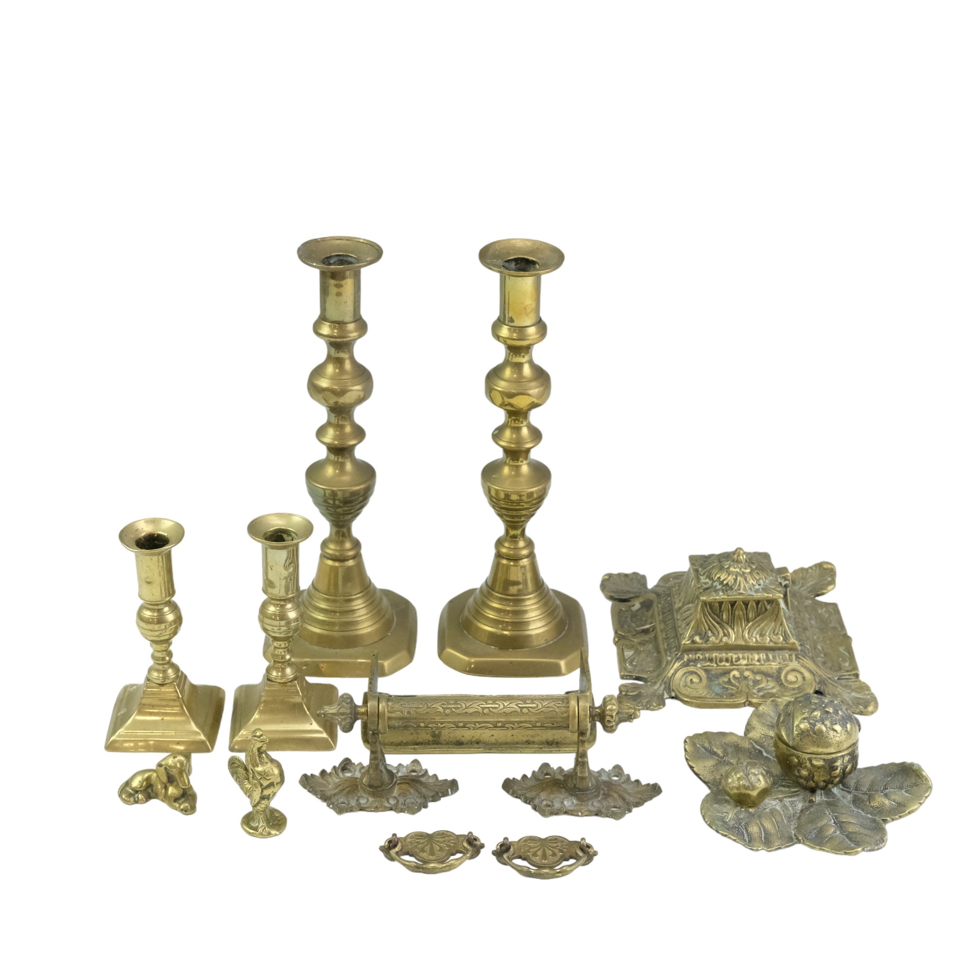 A quantity of Victorian and later domestic brassware including two pairs of candlesticks, two