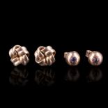 Two pairs of 9 ct yellow metal stud earrings, one pair in the form of knots, the other bosses set