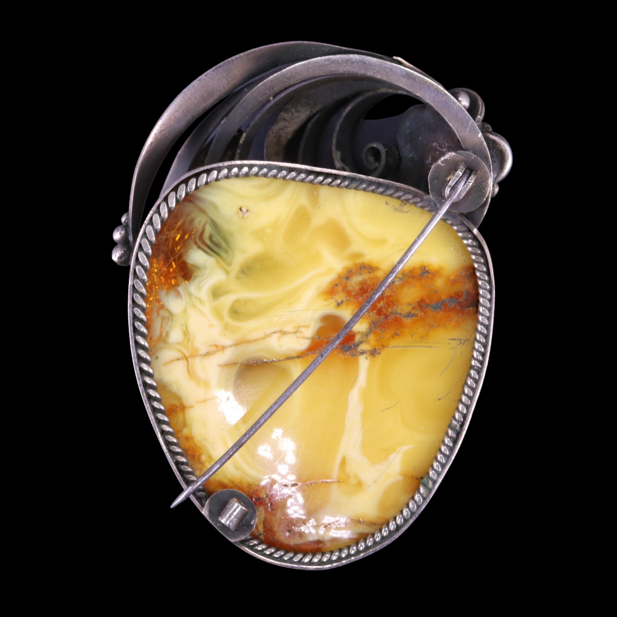 A large amber nodule brooch, bezel-set together with a small goldstone plaque and a facet-cut - Image 2 of 2