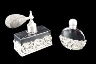 Two black glass scent bottles with silver-plated openwork floral decoration, tallest height 9.5 cm