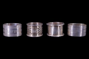 A pair of 1930s silver napkin rings together with two other silver rings, 155 g