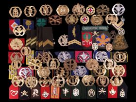 A large collection of Netherlands army and other military cap badges etc