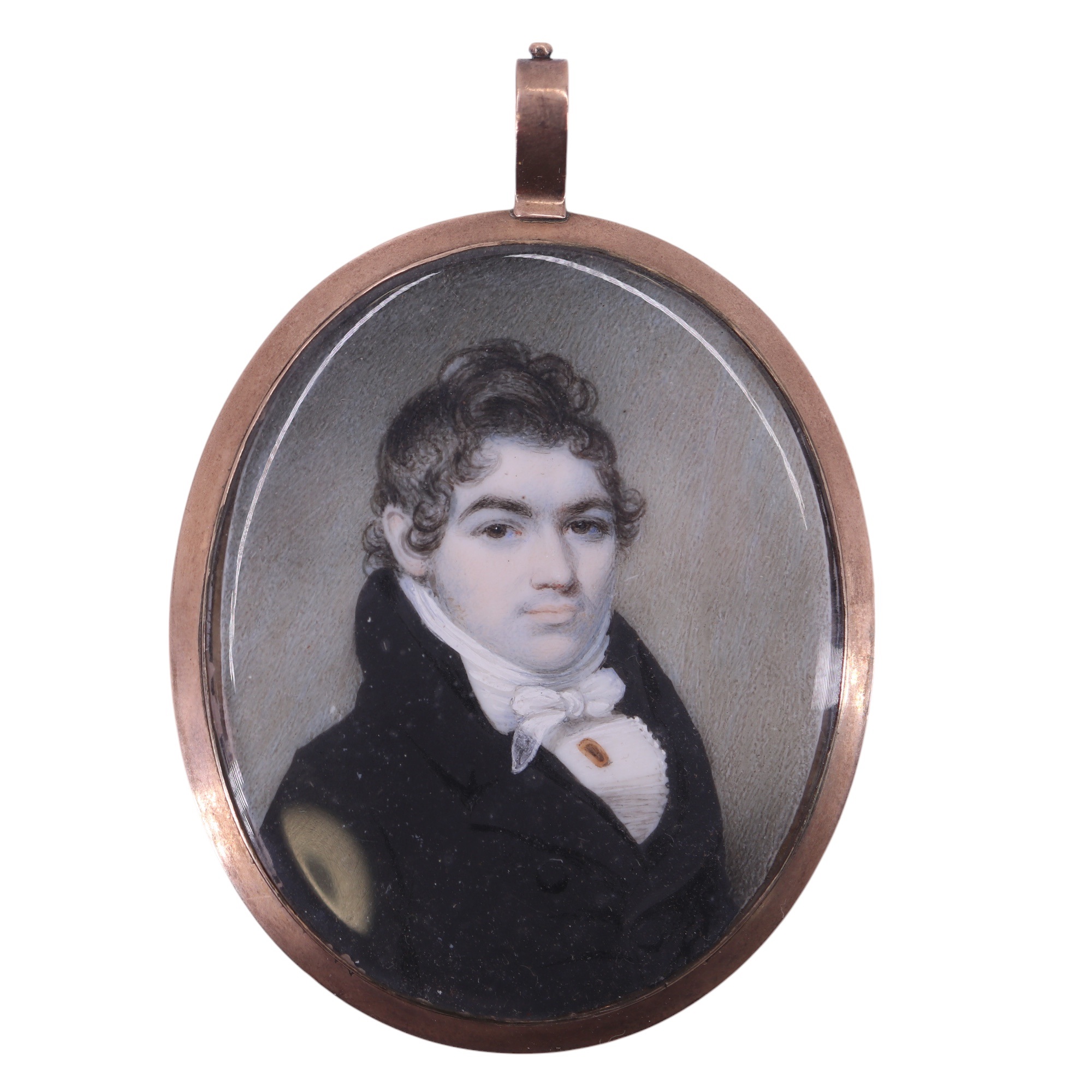 A late Georgian portrait miniature, of a gentleman poised with confidence, having coifed hair and