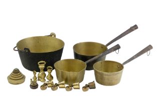A group of Victorian and later domestic brassware comprising a set of sauce pans, a jam pan, two