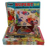 Five vintage Rupert Bear annuals together with a jigsaw, etc