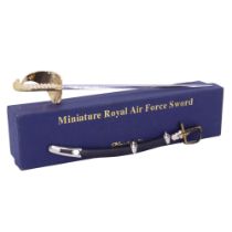A boxed Miniature Royal Air Force Sword by Nauticalia together with another diminutive sword, former