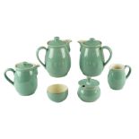 Four Denby stoneware jugs together with matching preserve pot and sugar bowl, tallest 17.5 cm