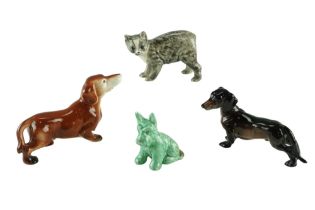 A Rushton Pottery cat together with a Sylvac (148) and two other dogs, tallest 8.5 cm