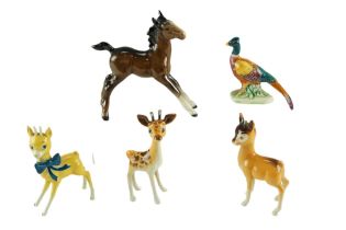 Five Beswick animal figurines including the Babycham faun, a Giraffe, etc