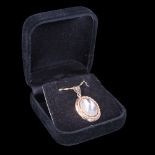 A moonstone pendant and chain, comprising an oval cabochon of approx 13 mm x 10 mm, set within a