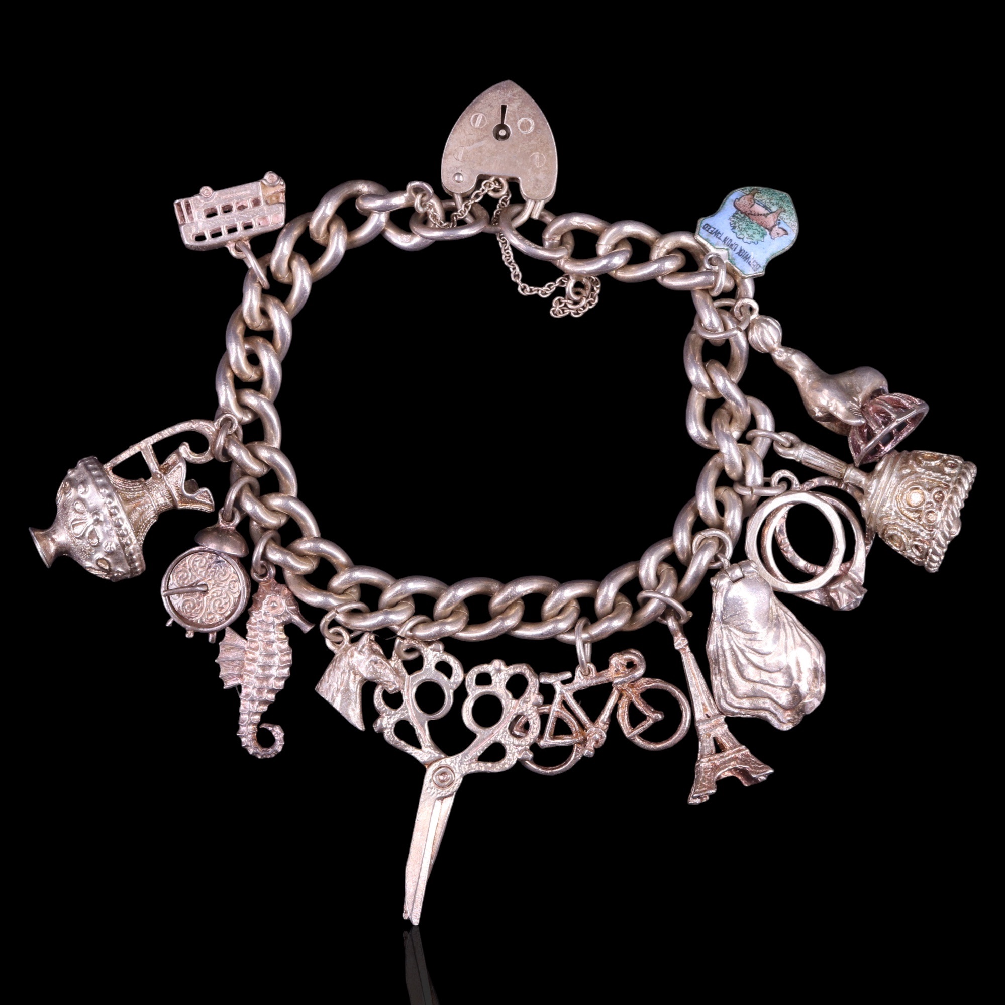 A vintage silver charm bracelet, 69 g