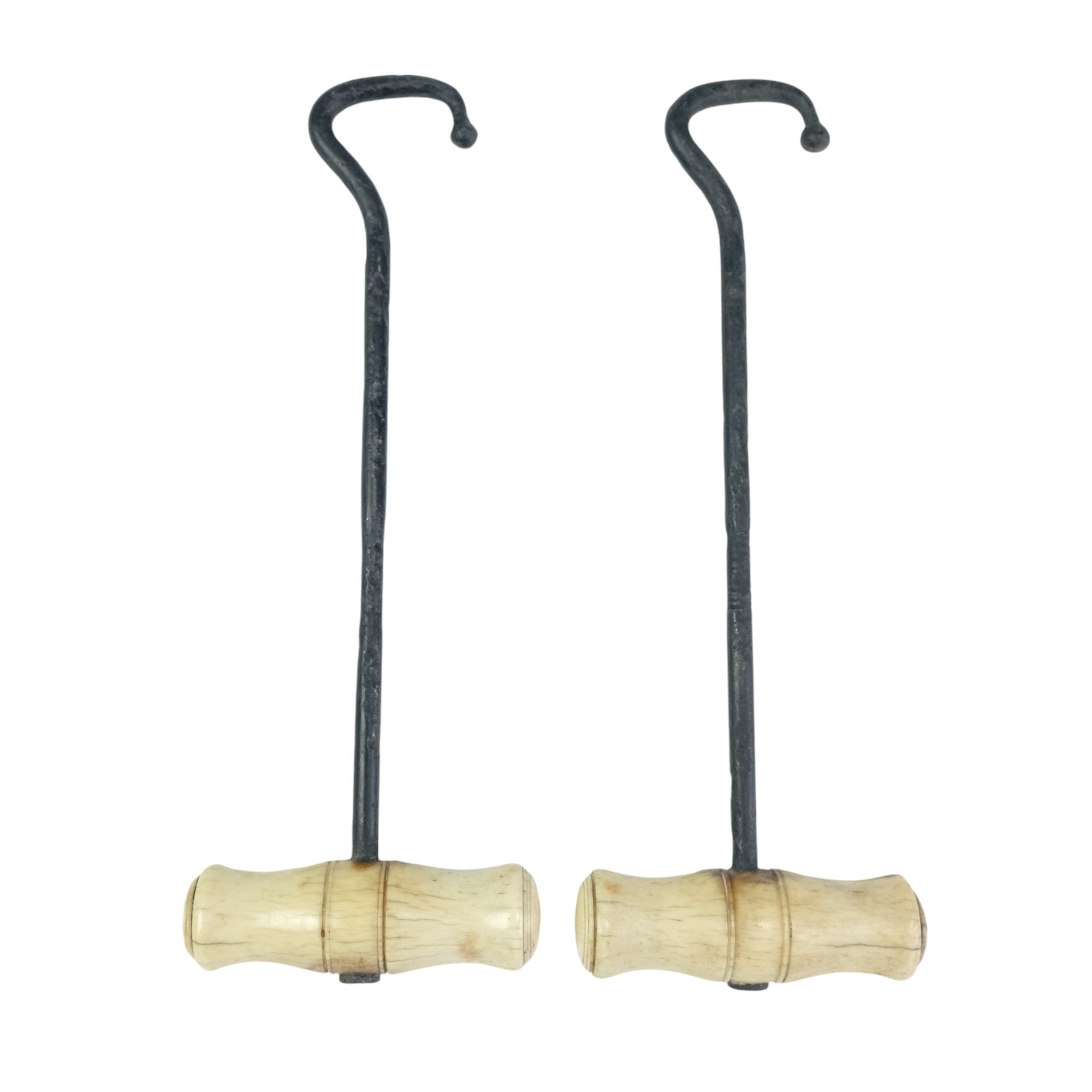 A pair of Victorian turned-bone-handled boot pulls