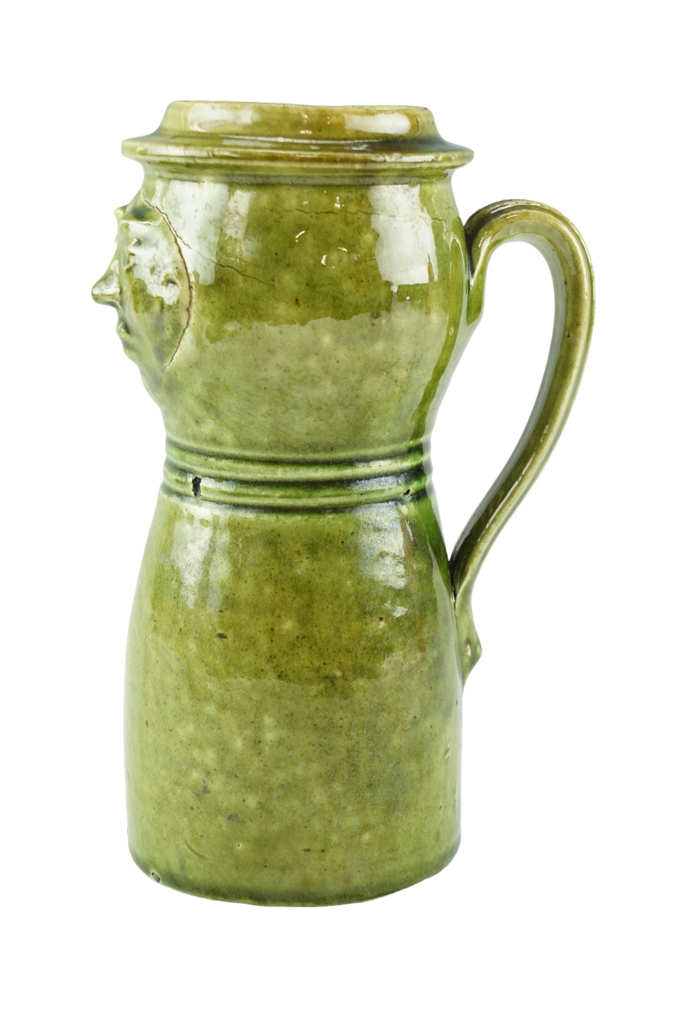 A late 19th / early 20th Century folk art / craft pottery green glazed earthenware mask jug, - Image 2 of 5