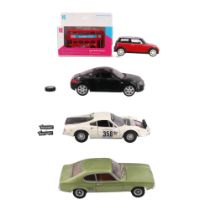 A Minichamps 1969-74 Ford Capri model car, 1:18 scale, together with two other diecast cars and a