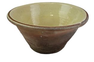 A late 19th / early 20th Century glazed earthenware dairy bowl, height 18 cm