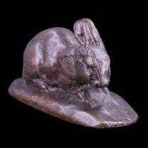 After Antoine-Louis Barye (1795 – 1875) An Animalier small bronze sculpture of a crouching rabbit