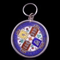 An enamelled Victorian Gothic Florin coin pendant in the manner of Probert or Steel