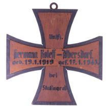 A German Third Reich painted wooden memorial plaque in the form of an Iron Cross, with