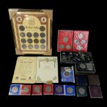 A large group of royal commemorative coins including a framed Royal Wedding coin collection, etc