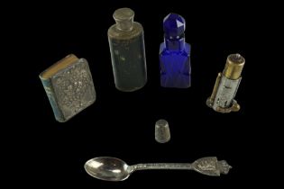 A silver thimble, a cobalt cut glass scent bottle, a small hip flask, a small silver-covered
