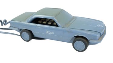 A 1980s Betacom Betacar novelty telephone modelled as a car, 22 x 9.5 x 7 cm