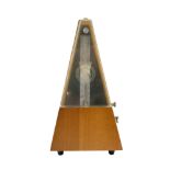 A mid-20th Century teak cased clockwork metronome by SX of Germany, 23.5 cm