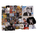 A large collection of Elvis Presley memorabilia including vinyl records, ceramics, CDs, books,