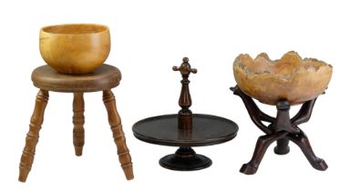 A group of treen including a late 19th / early 20th Century Lazy Susan, an African folding stand,
