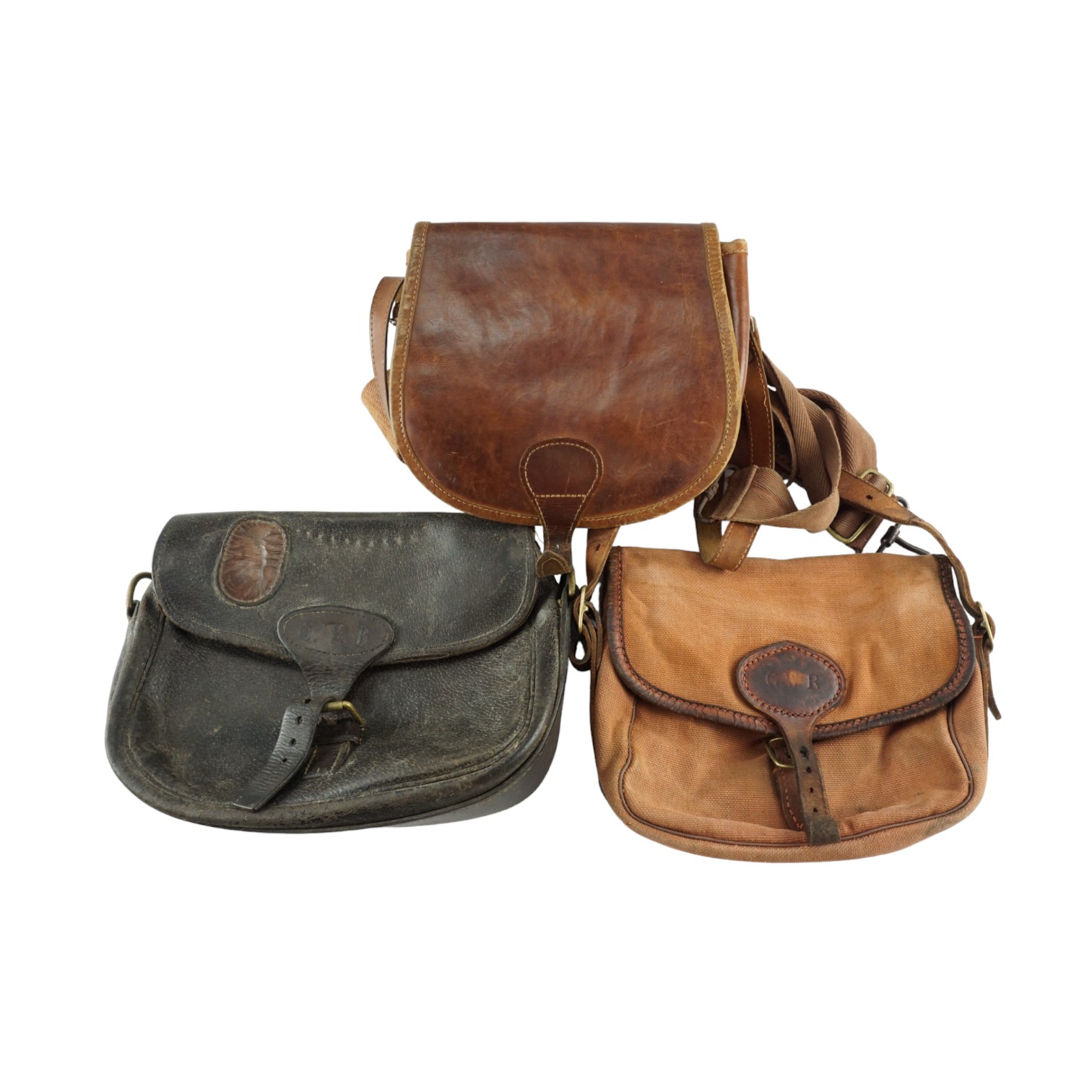 A vintage Brady leather-trimmed canvas shotgun cartridge bag together with two other bags