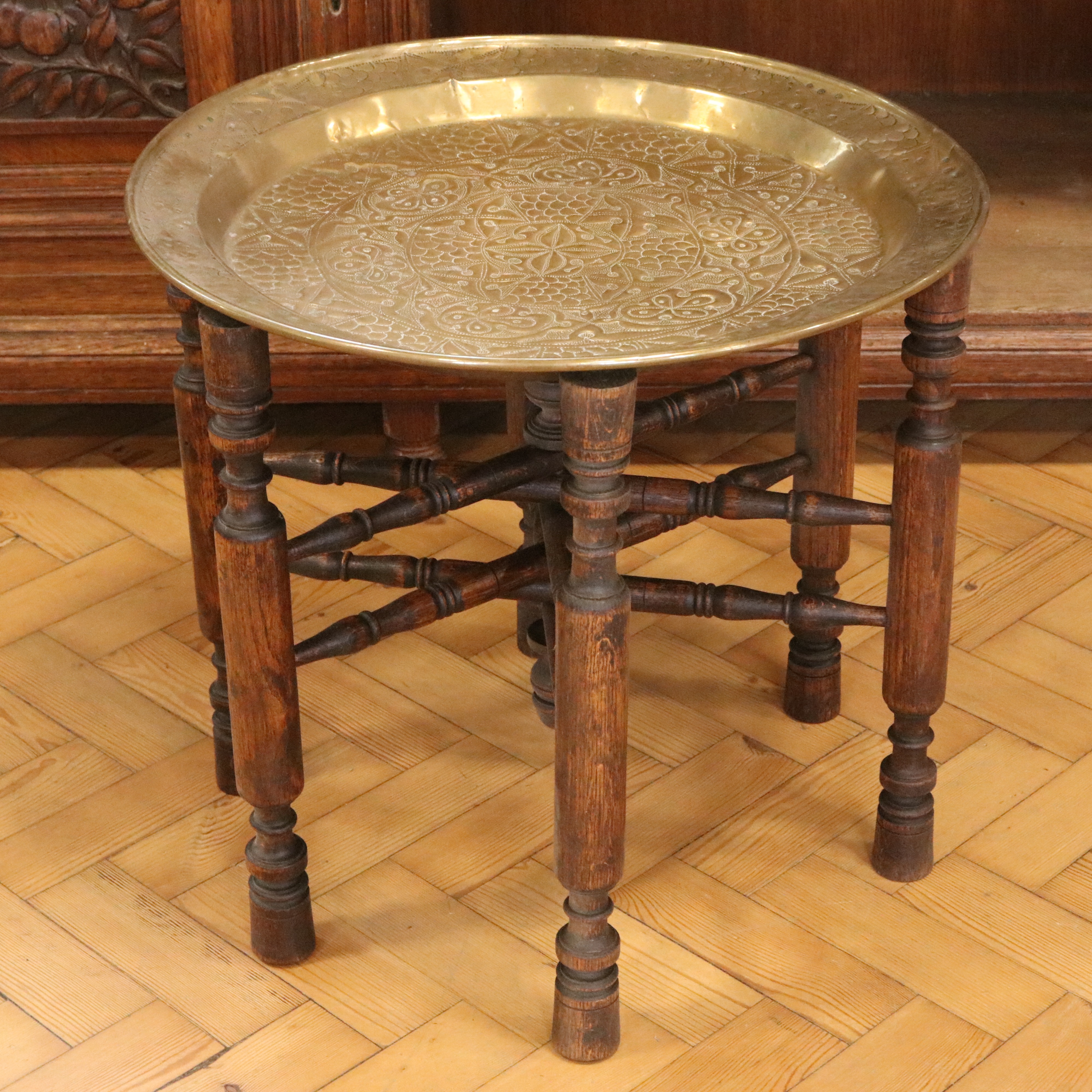 An early-to-mid 20th Century North African brass-topped folding table, 55 cm x 51 cm