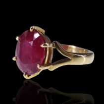 A 6 ct ruby solitaire ring, the stone claw-set between the bifurcated shoulders of an 18 ct gold