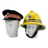 A Cumbria Fire Service peaked cap and fire helmet, 1983 - medium