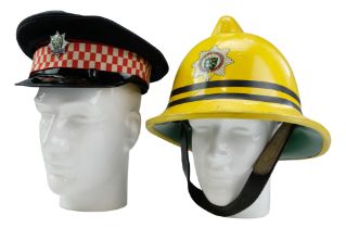 A Cumbria Fire Service peaked cap and fire helmet, 1983 - medium