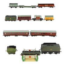 A quantity of Hornby Dublo model railway rolling stock, track, platform, two tenders, controllers