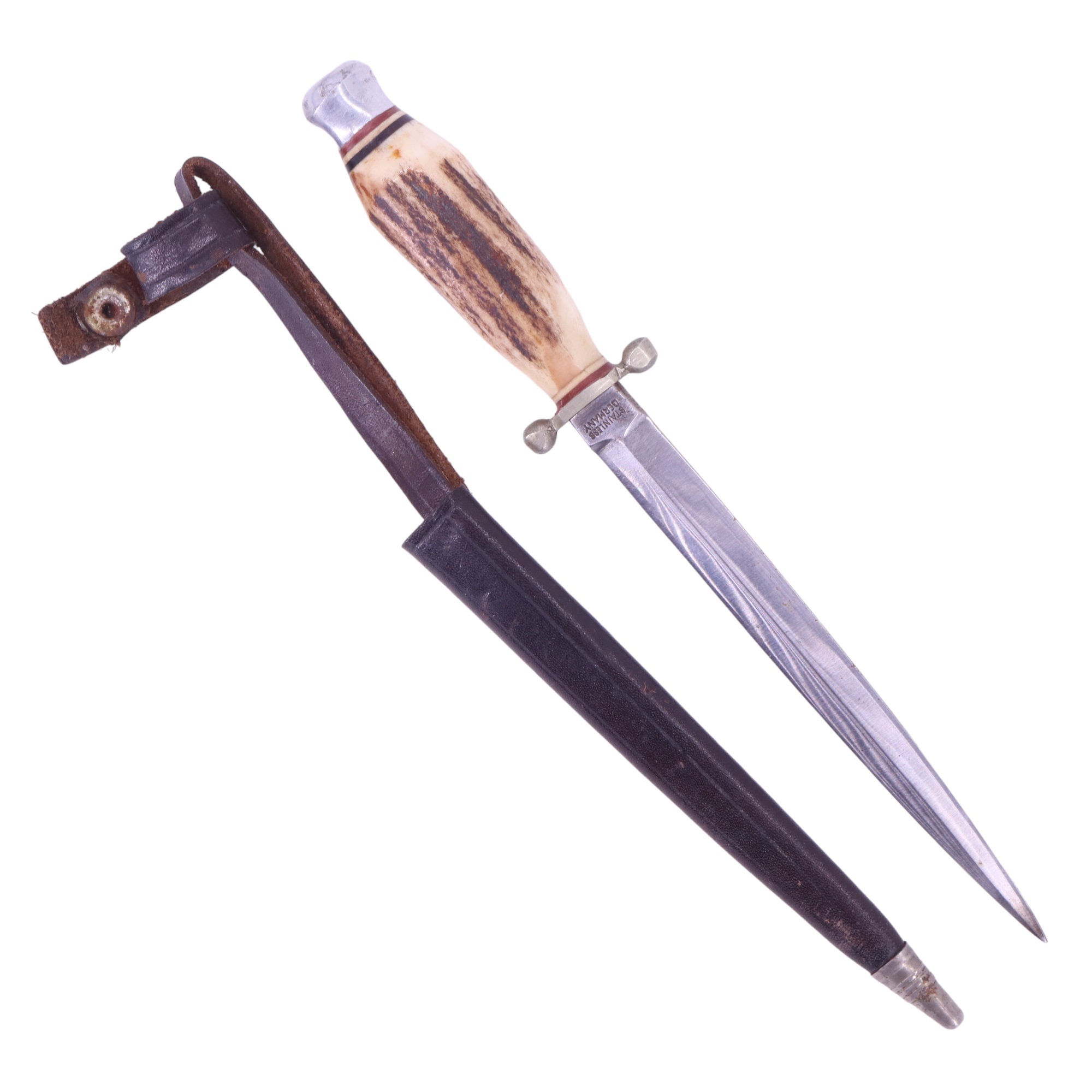 A small German stiletto, having an antler grip and leather scabbard, blade 13 cm, 21 cm overall